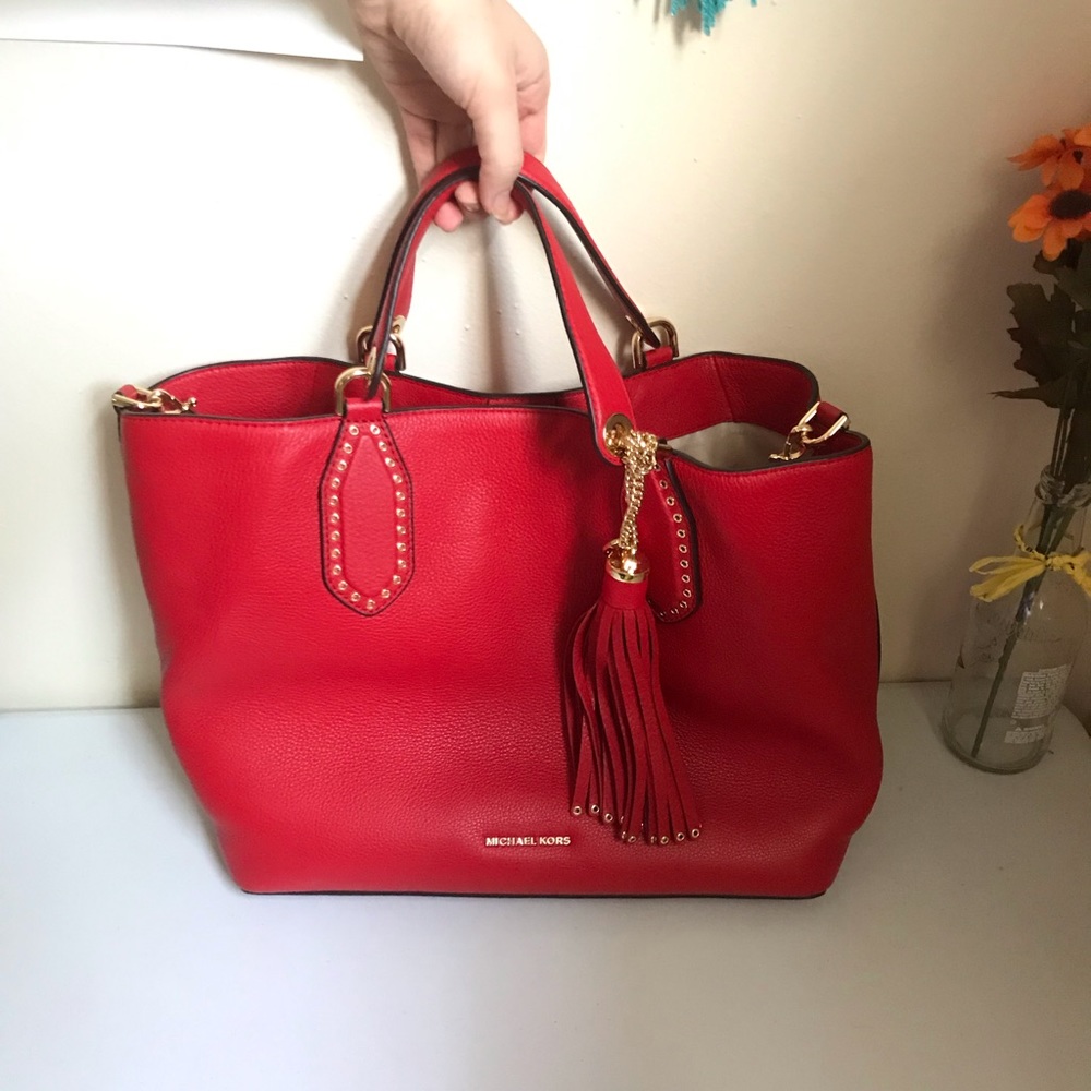 Michael Kors red purse with tassel